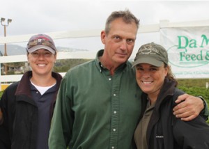 Benchmark supporters and horse trainers Lisa Westin and Kevin McGuinn strie a casual pose ringside with Samie Valla, events manager at El Sueno Equestrian Center.