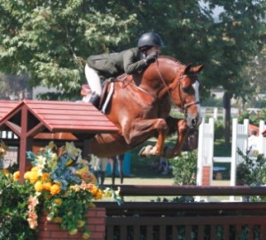 Morgan Geller and her horse Fabrico jump a hunter course.