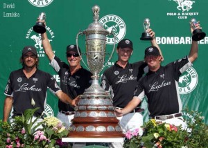 The Lucchese tean poses with the massive sterling Bomarbier Pacific Coast Open trophy.