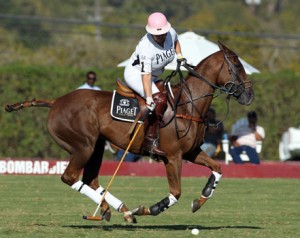 One of the few female high-goal polo players, Melissa Ganzi's uniform is accentuated by a pink helmet.