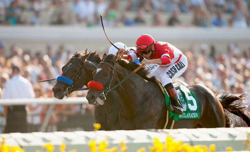 Acclamation and Patrick Valenzuela (in red) win the $1 million Pacific Classic.