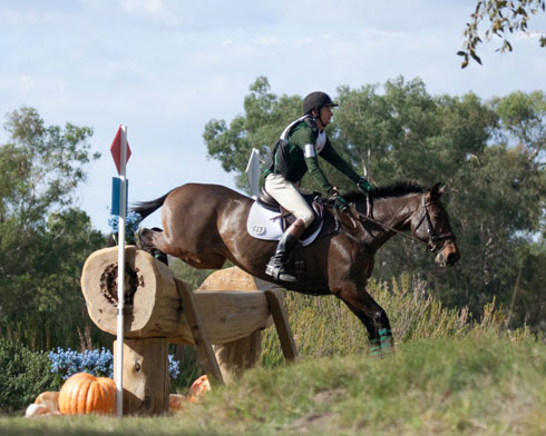 James Alliston and Jumbo's Jake leap over a giant log on the cross country field at the Galway Downs 3*.