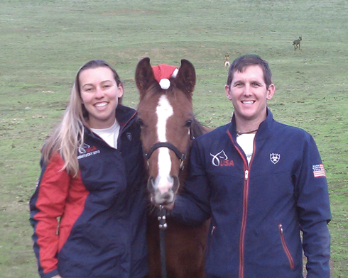 Heather and Jeremy Reynolds pose with their colt Liger, in his Santa hat.