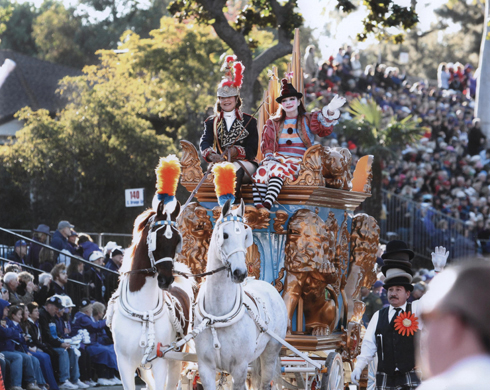 A colorful Scripps Miramar float is pulled by two stunning Saddlebreds.