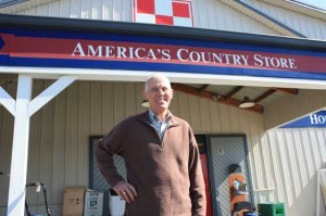 Larry Lumsdon strikes a jaunty hand-on-hip pose in front of America's Country Store.