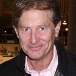 Robert Ridland standing in the Los Angeles Equestrian Center's Equidome