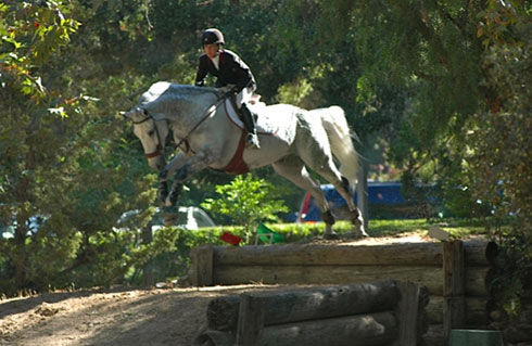 Tammy Chipko and Lisone jump a bank.