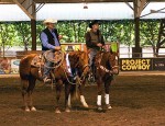 Winner and reserve champ astride their horses at Project Cowboy.