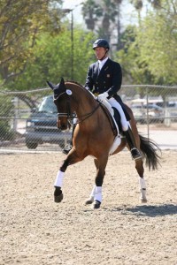 Guenter Seidel rides dressage on Fandango, a bay horse.