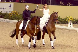 Wearing a "Phantom of the Opera" mask, Guenter Seidel riding Fandango in a pas de deux with Elizabeth Ball.