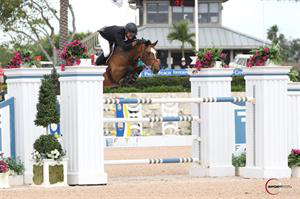 Charlie Jayne and his horse Athena clear a jump.