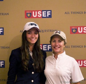 Reed Kessler and Margie Engle post informally in baseball caps.