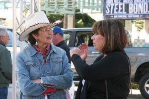 Miki Nelsen (right) talks to Cowgirl Sara Curtis.