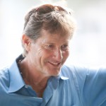 Portrait of Robert Ridland in sunshine wearing a sky blue shirt.