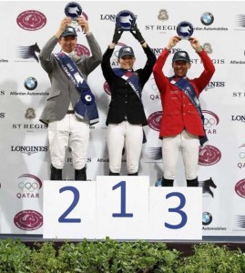 Trio of riders accept medals at the podium.