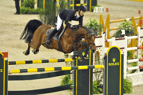 Switzerland's Steve Guerdat soars over the Rolex oxer at the World Cup Finals.