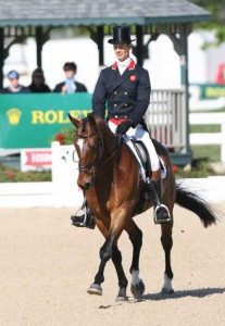 Looking natty in a very tall top hat and red-trimmed shadbelly, William Fox-Pitt rides Parklane Hawk in the dressage test.