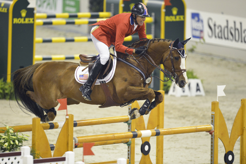 Rich Fellers and Flexible clear a huge oxer at the World Cup Finals.