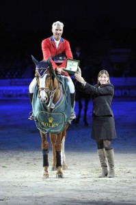 Rich Fellers and Flexible accept their trophy watch at the World Cup Finals.