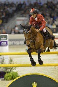 Pius Schwizer and Carlina seen from the front clearing a vertical.