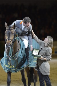 Philipp Weishaupt receives his Rolex watch from Magali Dubois Vaucher .