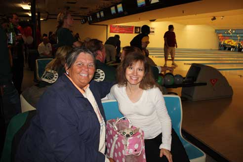 Kathy Hobstetter and Paula Parisi pose with dog.