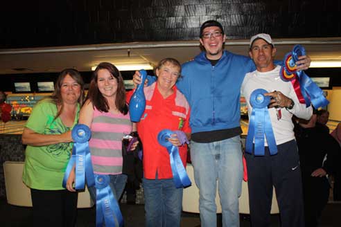 Bowled over team poses with its first place ribbons.