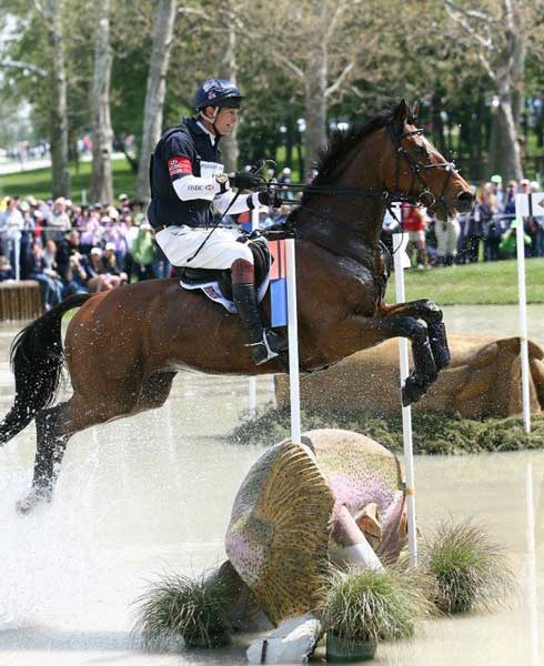 William Fox-Pitt and Parklane Hawk splash through a cross-country jump at Rolex.