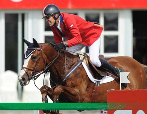 Rich Fellers and Flexible clear a jump at Spruce Meadows.