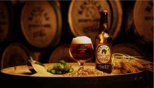 Alltech Lexington Brewery's Kentucky Ale foams over the top of a cold glass.