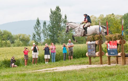 Kristi Nunnink and R-Star clear a massive ditch brush jump on the cross country course.