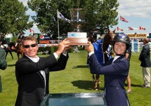 Tom Tisbo of Suncast and rider Reed Kessler jointly hoist the Suncast Cup trophy.