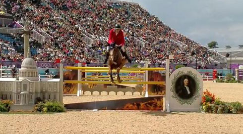 Rich Fellers and Flexible clear a jump against the background of a packed Greenwich Stadium in London.