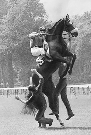 Jockey Jean Cruguet aboard a rearing horse.