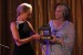 Portia de Rossi accepts her bronze trophy from Mayisha Akbar.