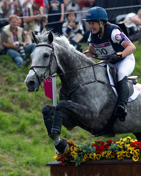 Tiana Coudray and her grey mount on the cross country course.