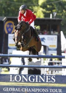 Hans-Dieter Dreher and Magnus Romeo clear the Longines jump.