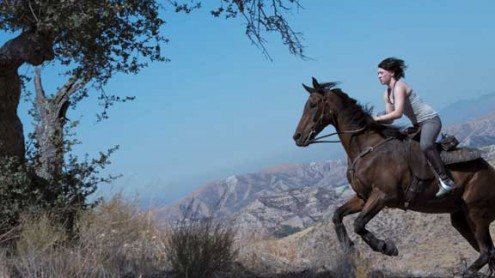 Sara Warner and Tower ride hills of Southern California under bright blue skies.