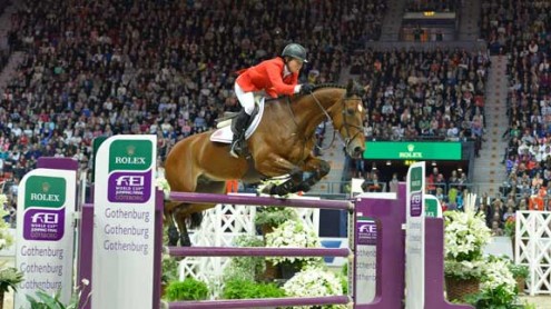 Beezie Madden and Simon jump before a crowd packed to the rafters.