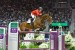 Beezie Madden and Simon jump before a crowd packed to the rafters.