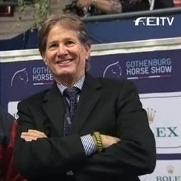 Robert Ridland smiling on the sidelines at the World Cup.