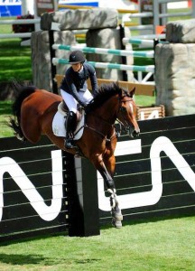 Ashlee Bond and Wistful clear a huge plank jump at Spruce Meadows.