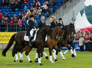 U.S. dressage team at claim their third-place award in Aachen.