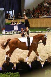 Alicen Divita does a handstand on her horse's back.