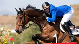 Close-up of Lane Clarke jimping with Casseur de Prix