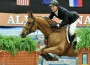 McLain Ward and his horse Rothchild jump a mock brick building at the Alltech National Horse Show.