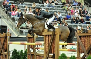 Richard Spooner clears a jump on his horse Cristallo using his distinctive "forward seat."