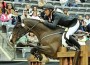 Richard Spooner clears a jump on his horse Cristallo using his distinctive "forward seat."