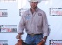 Cowboy Ethen Thouvenell poses with his trophy saddle.