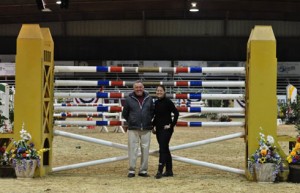 Sacramento International Horse Show's Rudy Leone and ProEquest's Allison Ekeroth stand in front of the five-bar jump.